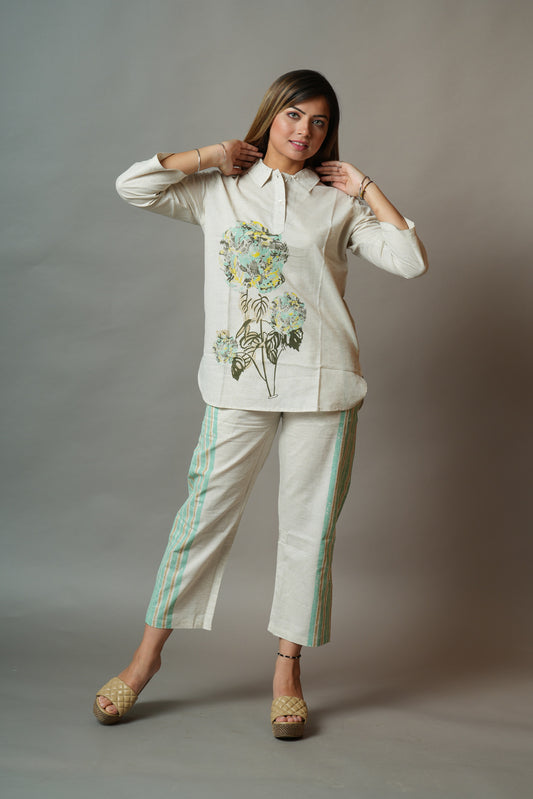 Beige flower print top with striped pants